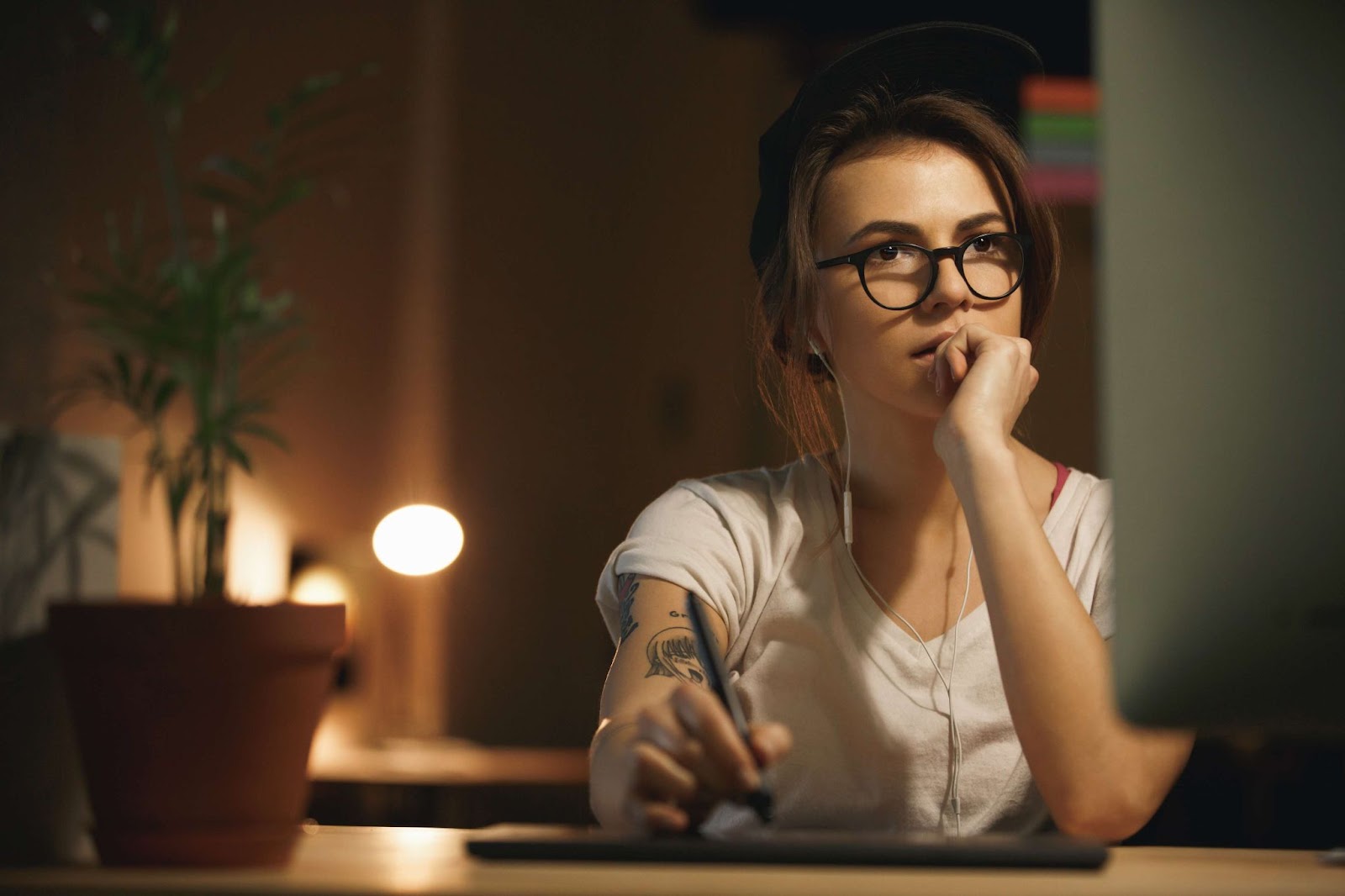 A focused woman working on her computer