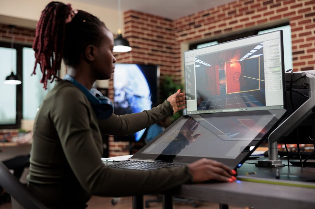 A woman works with design at her computer