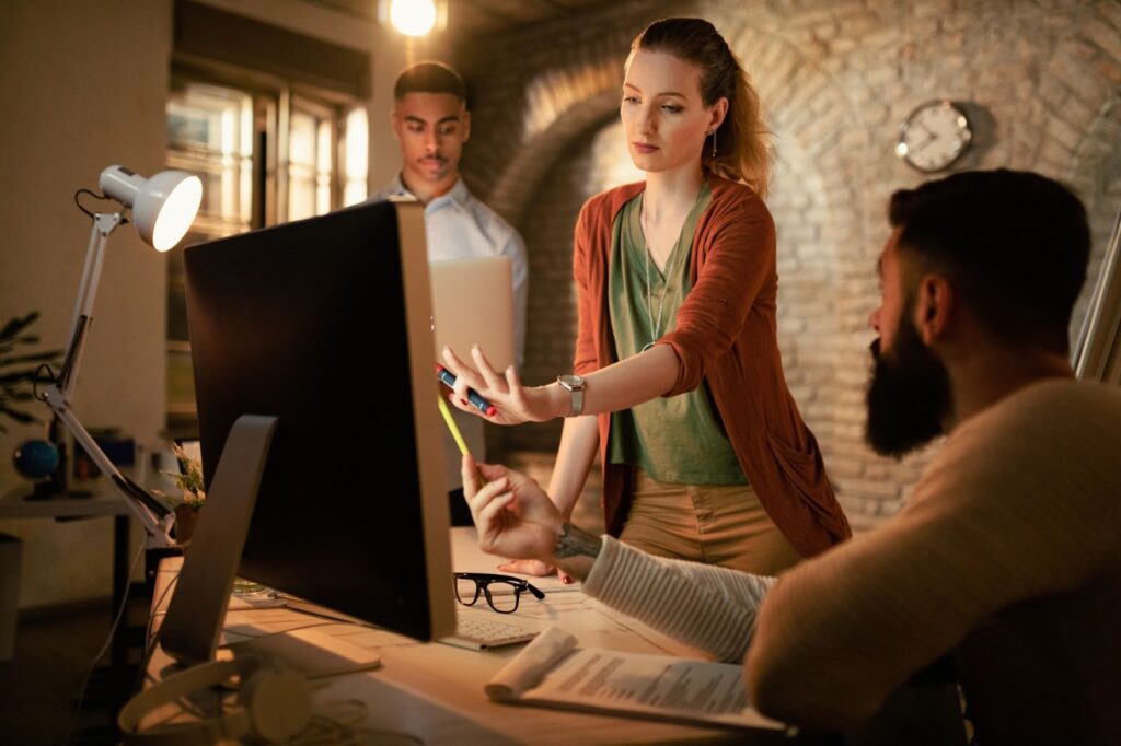 A group of people discussing a project at work